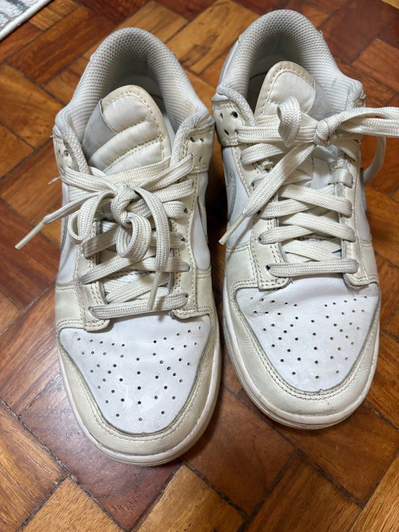 Nike Dunk Low for women (Category: Sneakers) located in Mandaluyong City. Submitted by mfp08 (Listing ID 1394027358, Image 1). Description: Nike Dunk low in 2 different colorway. First one - white with light yellow, size 36.5/23cm Second one - beige/nude/gold, size 36/22.5cm Take both for 1500php RFS: decluttering.