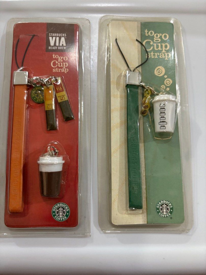 Starbucks collectibles - Mobile phone strap (Category: Mounts & Holders) located in Paranaque City. Submitted by shopofashopaholic (Listing ID 1394203804, Image 1). Description: Authentic, original Starbucks collectible merchandise Brand new, never used and still in their original packaging Prices is per item, discount if taking all. There are mobile phone holders, can also be used as bag charms.