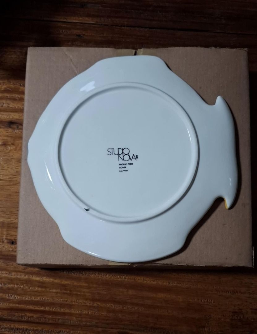 Studio Nova Tropic Fish Decorative Plate (Category: Dinnerware & Cutlery) located in Quezon City. Submitted by m_decluttering_sale (Listing ID 1394138840, Image 2). Description: Studio Nova Tropic Fish Decorative Plate – Collectible 🐠✨ Brand: Studio Nova Design: Tropic Fish (AC056) Material: Ceramic/Porcelain Origin: Philippines Size: 10" Condition: Excellent, vintage, Brand new, pre-owned Details: Beautiful and colorful fish-shaped plate with a