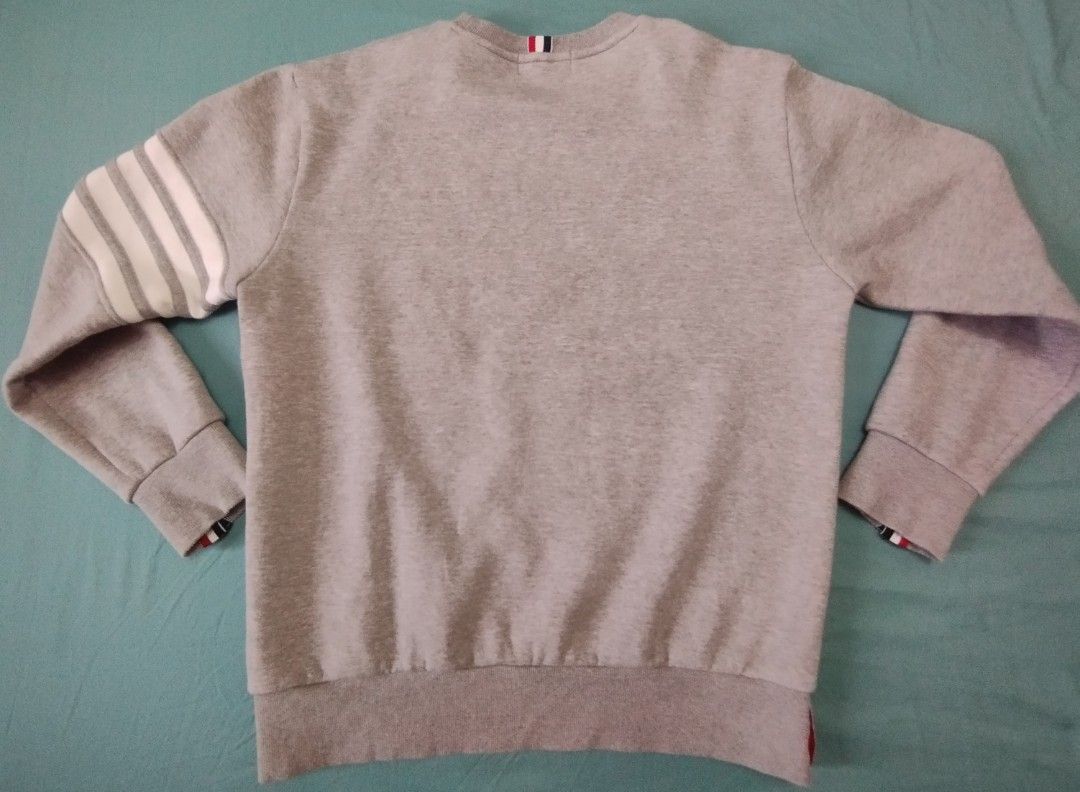 Thom Browne Sweatshirt (Category: Coats, Jackets and Outerwear) located in Antipolo. Submitted by d.tuazon (Listing ID 1394027901, Image 2). Description: Thom Browne Sweatshirt.Size 22inches width and 28inches length .Price 1,595 only.The retail price for New Thom Browne Classic Loopback Crew Neck Sweatshirt ranges from $700 to $850 USD (approximately ₱27,000 to ₱49,000 PHP) depending on the specific seasonal variant, size, and luxury retailer.Se