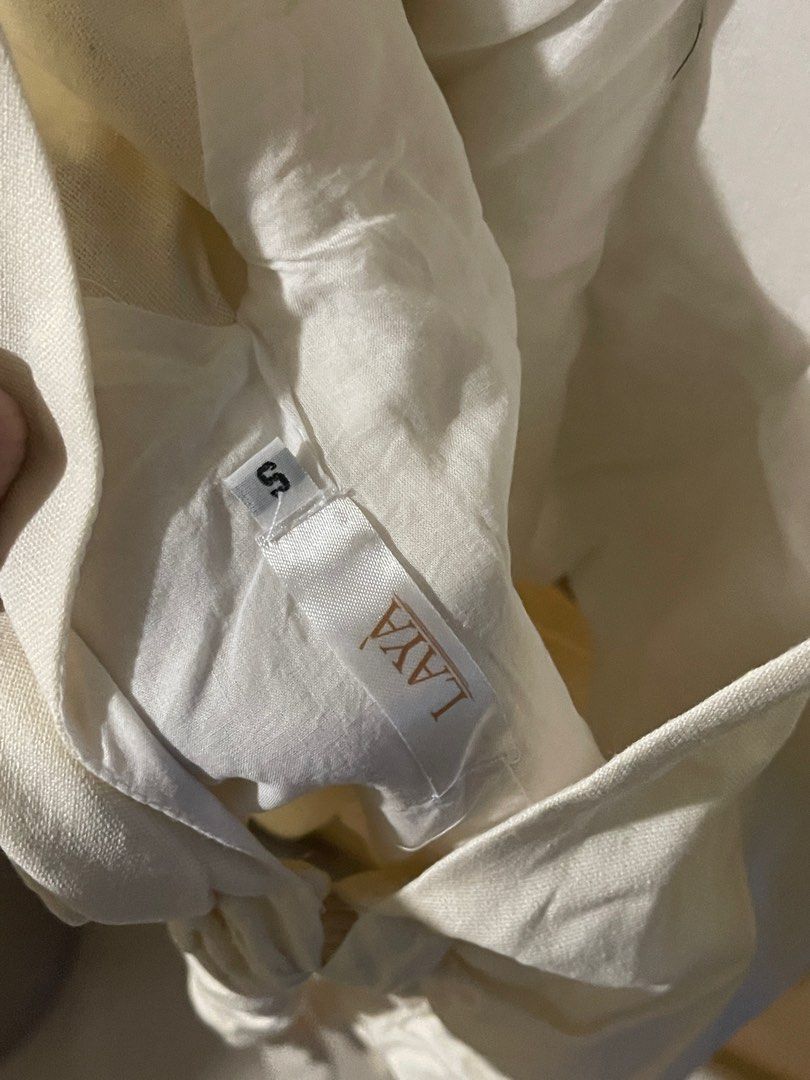 Wearlaya cream linen top (Category: Blouses) located in Quezon City. Submitted by vee222 (Listing ID 1394106125, Image 2). Description: fits XS to semi medium.