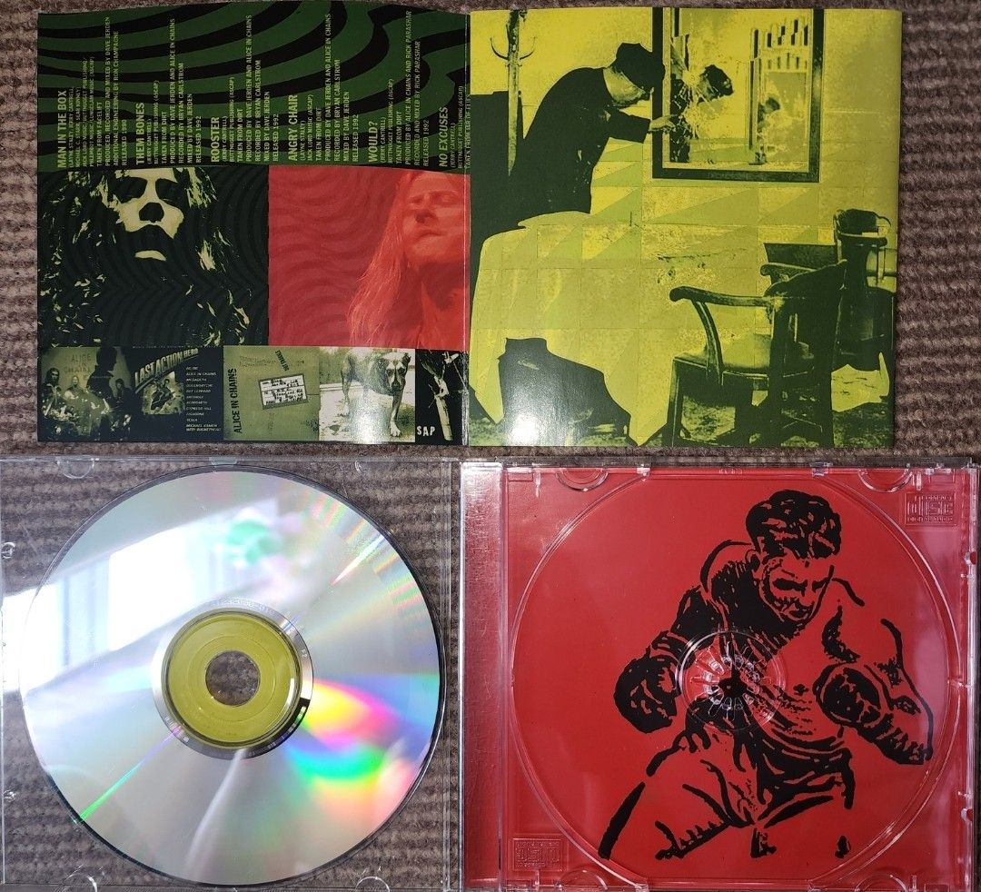 Alice in Chains - Live (Category: CDs & DVDs) located in Cebu City. Submitted by g_roshamboo (Listing ID 1394399977, Image 3). Description: Alice in Chains "Live" CD. Features tracks like "Rooster", "Would?", "Junkhead", and "Dirt". Includes the CD, the jewel case, and the album booklet with lyrics and photos from the live performance. The CD has a silver surface with the band's name and album title printed on it..