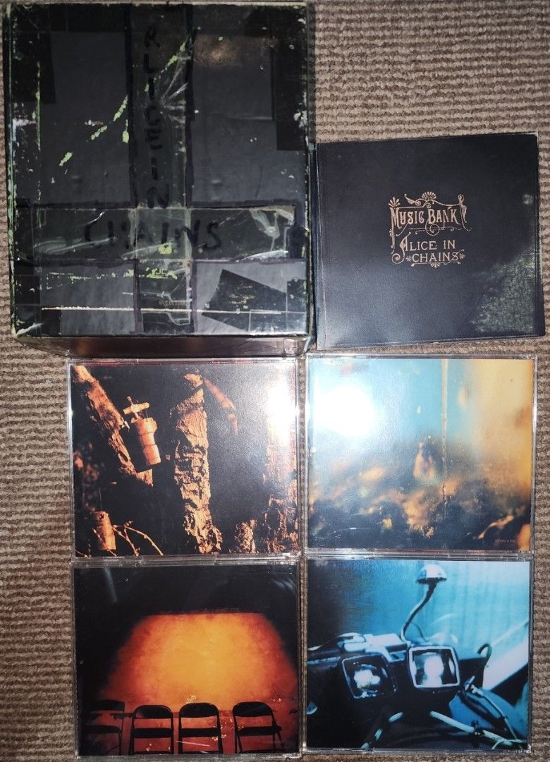 Alice in Chains - Music Bank Box Set (Category: CDs & DVDs) located in Cebu City. Submitted by g_roshamboo (Listing ID 1394396160, Image 3). Description: 4 Cd. Box is heavily taped. with writings on the box. Disc 3 is heavily used and will skip on the latter part Comes with the booklet.