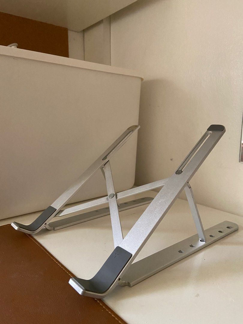 Aluminum Laptop Stand (Adjustable and Foldable) (Category: Laptops & Notebooks) located in Bacoor. Submitted by decluttergirlie2 (Listing ID 1394402731, Image 1). Description: RFS: Di na nagagamit Location: Bacoor, Cavite.