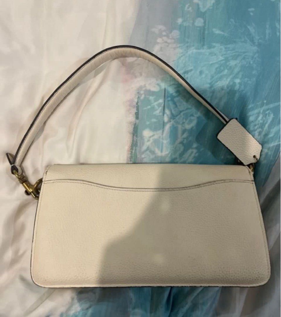 RUSH Auth - Coach White Tabby 26 (Category: Luxury Bags & Wallets) located in Quezon City. Submitted by alwaysdecluttering505 (Listing ID 1394310186, Image 2). Description: Comes with another strap Has signs of use, but i dont use it that much. Selling low Can give entrupy verification, but with a small fee .