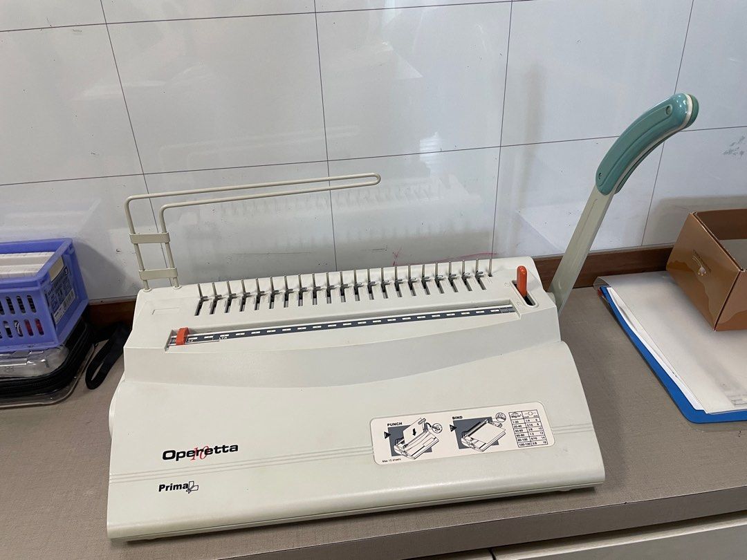 Binding Machine (Category: Stationery & School Supplies) located in Singapore. Submitted by chriszse (Listing ID 1394252939, Image 1). Description: - Operetta Prima Binding Machine - Sturdy build - Suitable for various binding needs.