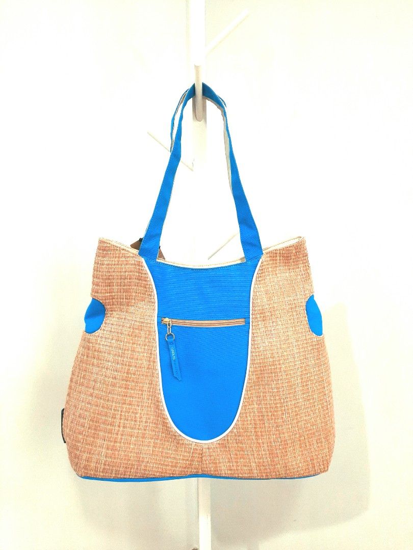 Gravis Laguna Basket Weave Tote Bag (Category: Tote Bags) located in Quezon City. Submitted by mkaeo (Listing ID 1394403669, Image 1). Description: - Gravis Laguna tote bag - Unique basket weave design - Blue accents - Zippered blue front pocket - "GRAVIS" tag - Spacious interior with multiple compartments - Includes "LAGUNA BASKET WEAVE 1 SIZE" tag.