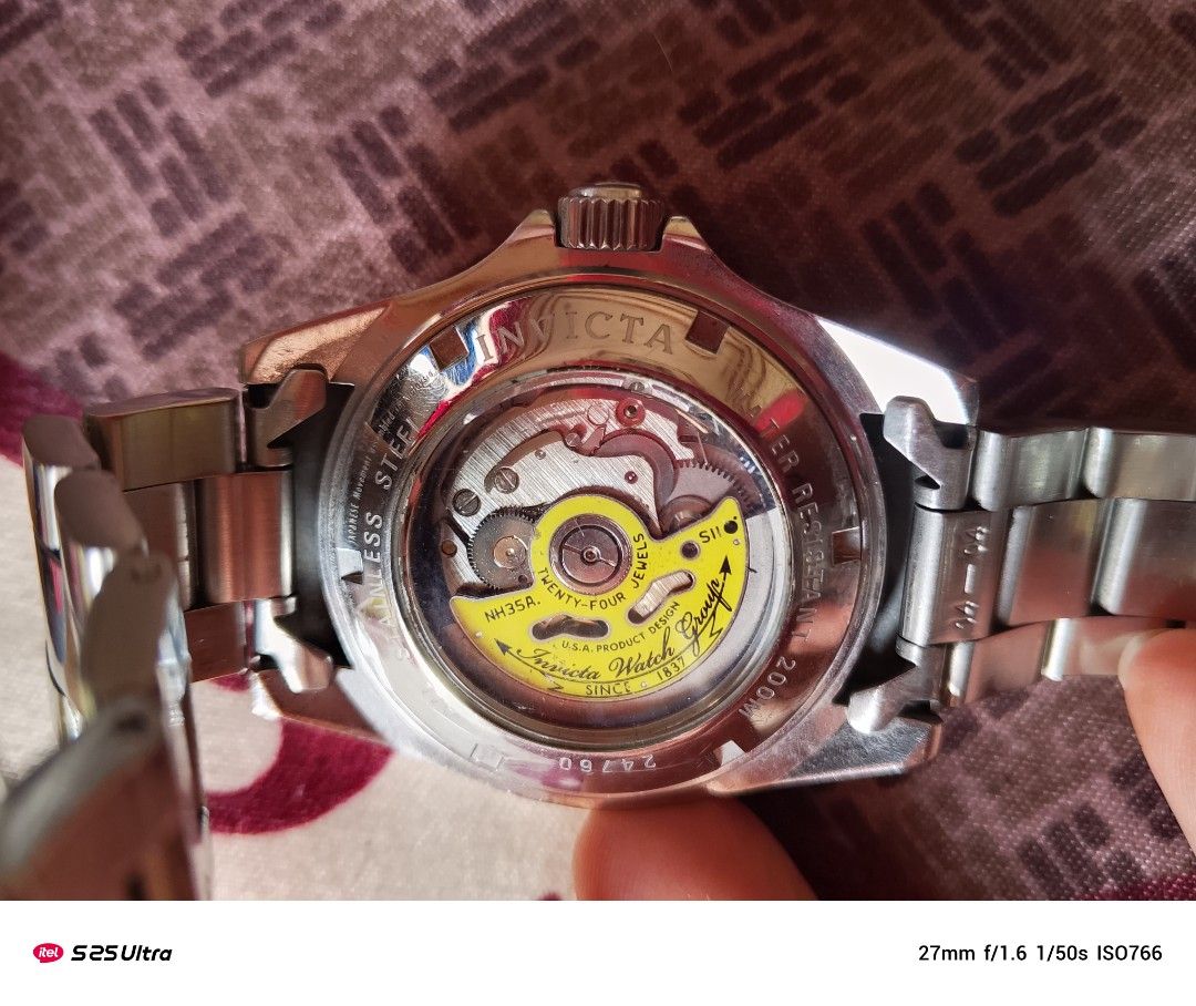 Invicta Automatic Watch (Category: Men's Watches) located in Manila. Submitted by swiftfalcon-a2f0 (Listing ID 1394339636, Image 3). Description: - Invicta Automatic Watch - Black dial - Stainless steel bracelet - Date display at 3 o'clock - Exhibition case back (see-through) - Rotating bezel - Invicta logo on clasp.