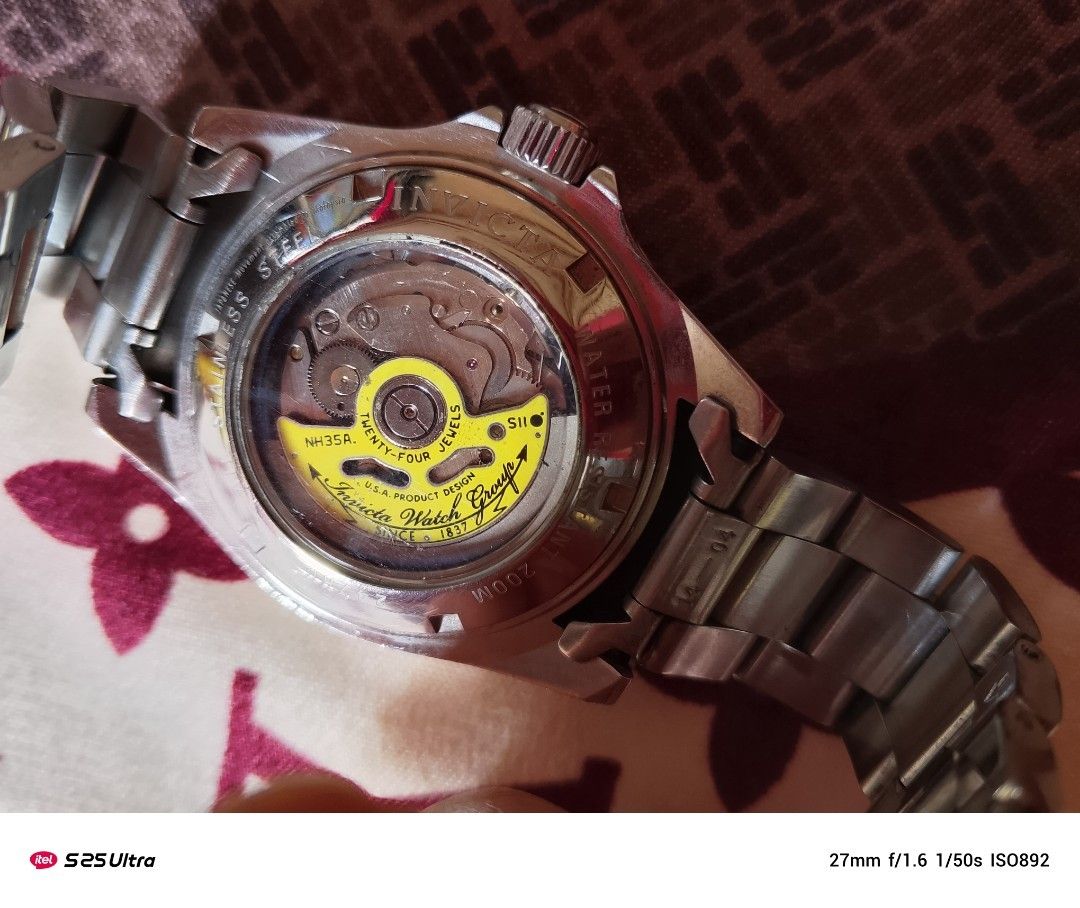 Invicta Automatic Watch (Category: Men's Watches) located in Manila. Submitted by swiftfalcon-a2f0 (Listing ID 1394341548, Image 2). Description: - Invicta Automatic Watch - Stainless Steel Band - Black Bezel - Black Dial - Date Display - Visible Movement (Back) - Silver-tone Case - Water Resistant: 200m.