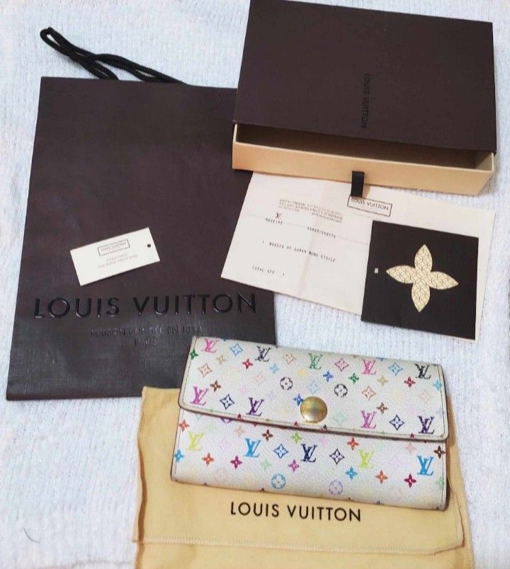 Louis Vuitton Multicolor Wallet (Category: Luxury Bags & Wallets) located in Manila. Submitted by selling.ph (Listing ID 1394401967, Image 2). Description: - Authentic Louis Vuitton multicolor wallet - Snap closure - Multiple compartments, including a zippered pocket - Comes with box, dust bag, paperwork, and shopping bag - Features the iconic Louis Vuitton multicolor pattern issue: snap button.