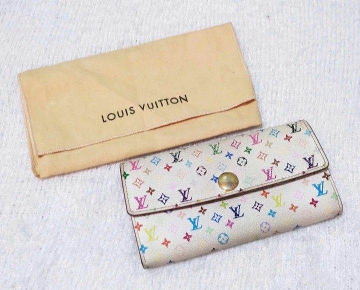 Louis Vuitton Multicolor Wallet (Category: Luxury Bags & Wallets) located in Manila. Submitted by selling.ph (Listing ID 1394401967, Image 1). Description: - Authentic Louis Vuitton multicolor wallet - Snap closure - Multiple compartments, including a zippered pocket - Comes with box, dust bag, paperwork, and shopping bag - Features the iconic Louis Vuitton multicolor pattern issue: snap button.