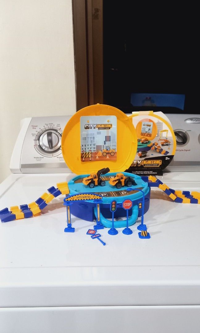 Preloved Trucks and Tracks in a Bag (Category: Vehicle & Diecast Models) located in Baguio. Submitted by team_mr (Listing ID 1394280954, Image 2). Description: includes 2 construction vehicles with signage excellent condition, rarely used issue, one traffic sign damaged base.