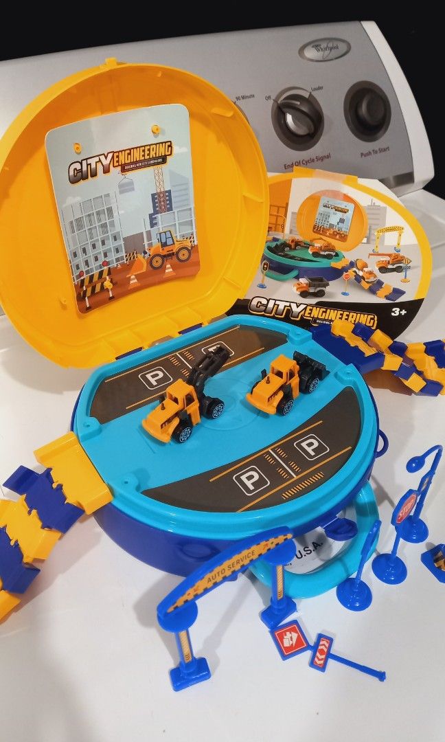Preloved Trucks and Tracks in a Bag (Category: Vehicle & Diecast Models) located in Baguio. Submitted by team_mr (Listing ID 1394280954, Image 3). Description: includes 2 construction vehicles with signage excellent condition, rarely used issue, one traffic sign damaged base.
