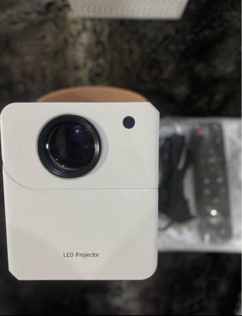 Smart Projector 4k HD Android Supported (Brand New)‼️ (Category: Projectors) located in Manila. Submitted by reluxx_deals (Listing ID 1394230348, Image 1). Description: FEATURES: • 8000 Lumens • 4K HD Resolution • Projective Light Source Life: 50,000 hours • Projection Size: 50 - 300 inches • Brightness: 1200 ANSI • Android V12 • Projection Distance: 0.8 - 5m9 • Supported with Play store, Bluetooth, Wi-fi, USB, Wifi Display • With Netflix, Youtub