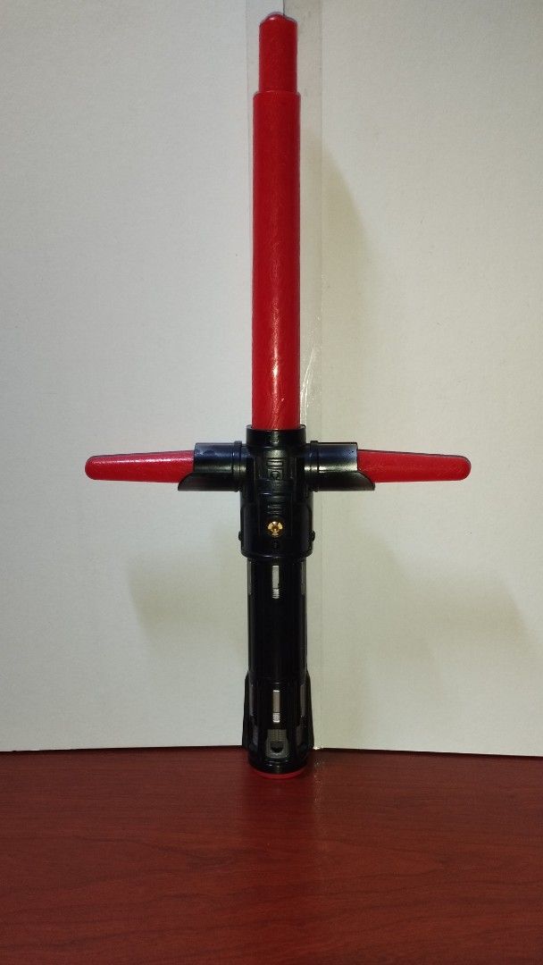 Star Wars Kylo Ren Lightsaber (Category: Western Merchandise) located in Manila. Submitted by alyssacorp68140 (Listing ID 1394269165, Image 2). Description: - Kylo Ren lightsaber Replica - Features a distinctive red blade and crossguard. - Hilt is black with silver accents. - Detailed internal design visible. - Includes a button on the hilt. - Inspired by the lightsaber from the Star Wars movies. ✅ WORKING LIGHT AND SOUNDS ✅ EXTENDABLE 💯 LEGIT S
