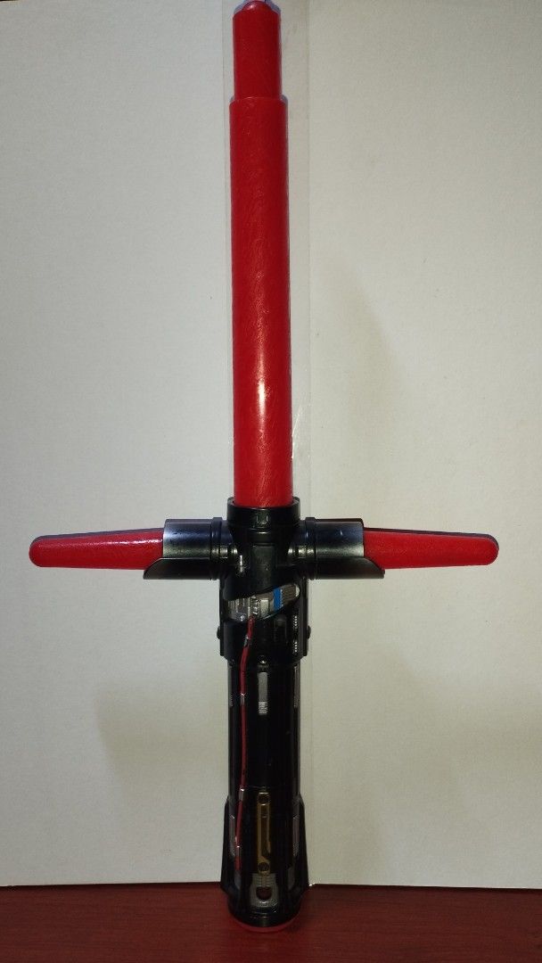 Star Wars Kylo Ren Lightsaber (Category: Western Merchandise) located in Manila. Submitted by alyssacorp68140 (Listing ID 1394269165, Image 1). Description: - Kylo Ren lightsaber Replica - Features a distinctive red blade and crossguard. - Hilt is black with silver accents. - Detailed internal design visible. - Includes a button on the hilt. - Inspired by the lightsaber from the Star Wars movies. ✅ WORKING LIGHT AND SOUNDS ✅ EXTENDABLE 💯 LEGIT S