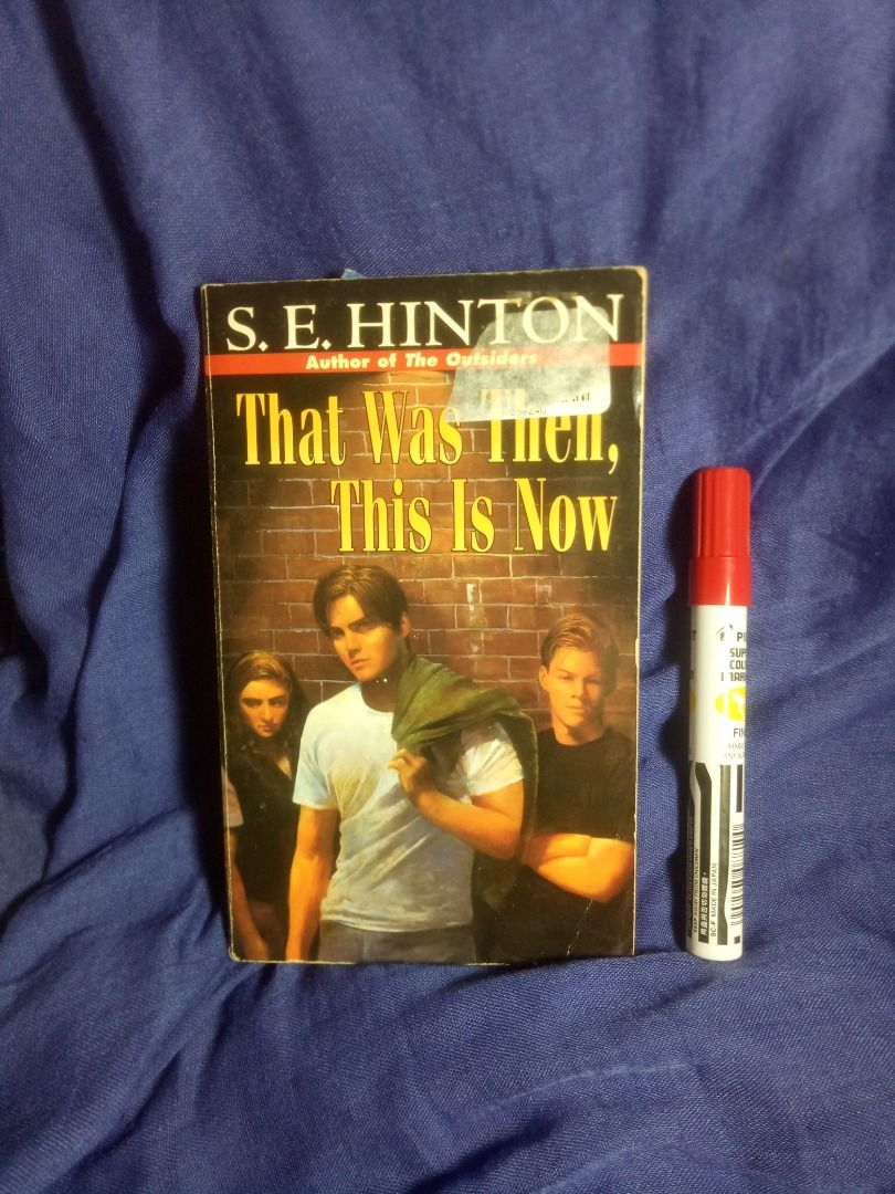 That Was Then, This Is Now by S.E. Hinton (Category: Storybooks) located in Makati City. Submitted by buyingblind (Listing ID 1394272755, Image 1). Description: - Title: That Was Then, This Is Now - Author: S.E. Hinton - Cover: Features three people and the title - Back Cover Summary: "Does growing up have to mean growing apart?" - Notable: ALA Notable Book - Condition: Pages are intact and readable.