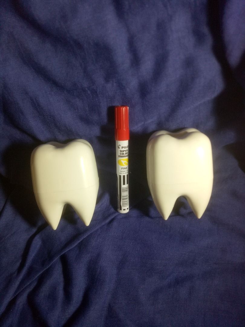 Tooth Dispenser / Toothbrush Holder/ Pen Holder (Category: Pitchers & Dispensers) located in Makati City. Submitted by buyingblind (Listing ID 1394281996, Image 1). Description: -Has slight discoloration from where sticker was; previously for giveaway but got stockpiled instead -Original price: Around Php 110; now 80 each - Set of two tooth-shaped dispensers - White dispensers with a hole on top - Designed for pens or small items - Comes with col