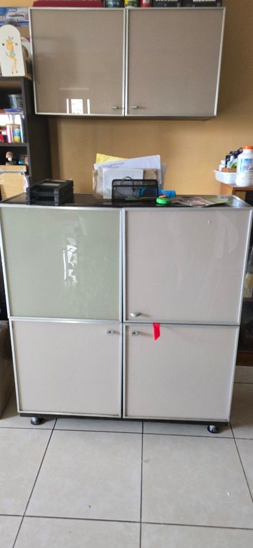 Wall shelves (Category: Shelves, Cabinets & Racks) located in Quezon City. Submitted by rabbittt75 (Listing ID 1394262573, Image 1). Description: - Office cabinet with multiple compartments - Light-colored exterior - Silver-colored frames 4 door shelf can be stand alone. 2 door shelf is wall hang - Ideal for storing office supplies and documents.