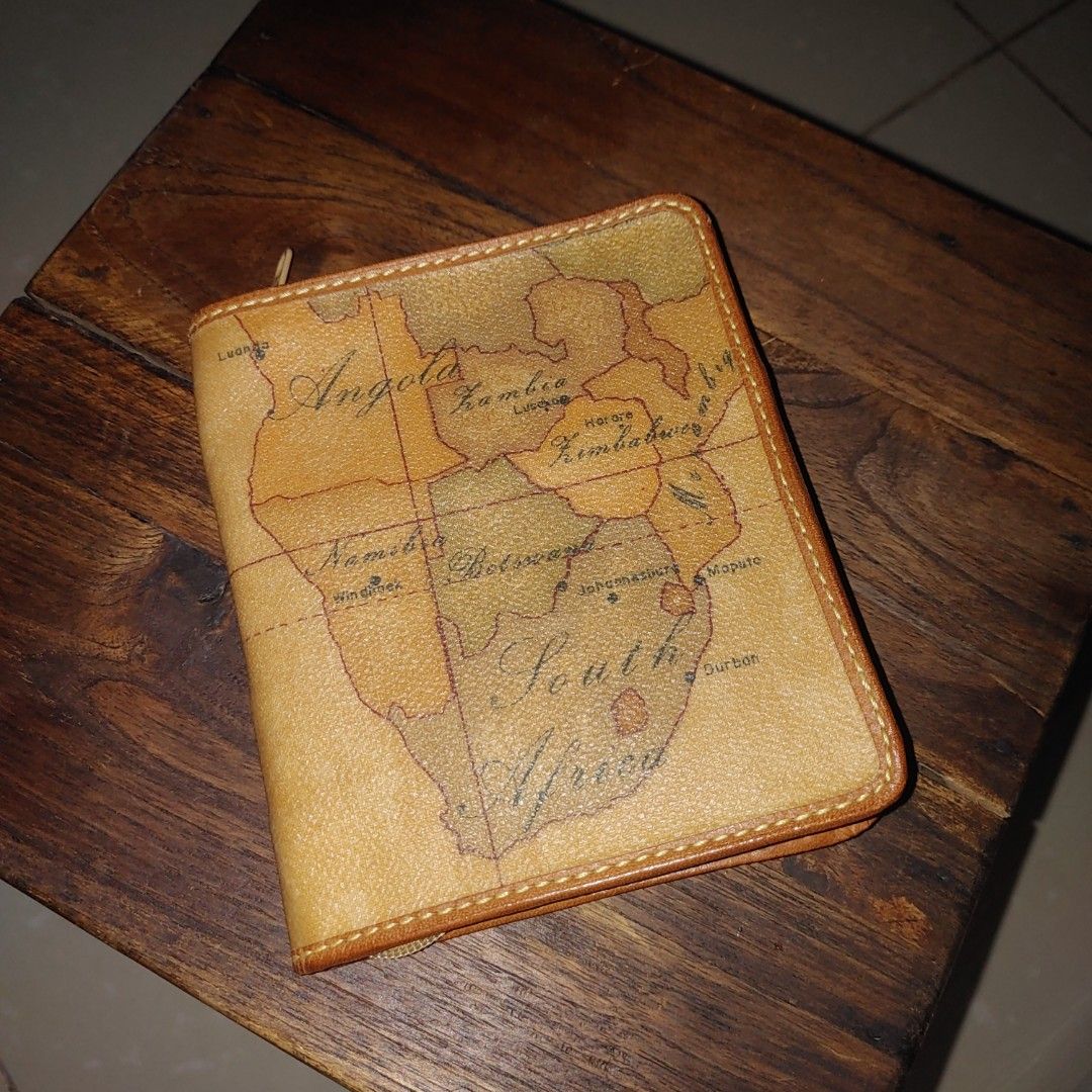 Alviero Martini Geo Map Wallet (Category: Luxury Bags & Wallets) located in Davao. Submitted by zenflower_2e78e8 (Listing ID 1394569110, Image 1). Description: - Authentic Alviero Martini wallet - Unique geo map design - Multiple card slots - Secure zippered closure - Compact size - Light brown interior lining - Brand name visible inside.