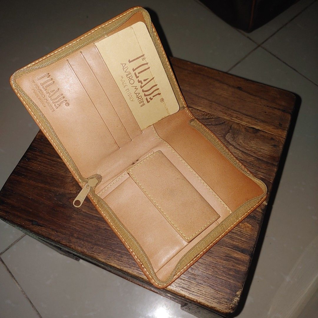 Alviero Martini Geo Map Wallet (Category: Luxury Bags & Wallets) located in Davao. Submitted by zenflower_2e78e8 (Listing ID 1394569110, Image 3). Description: - Authentic Alviero Martini wallet - Unique geo map design - Multiple card slots - Secure zippered closure - Compact size - Light brown interior lining - Brand name visible inside.