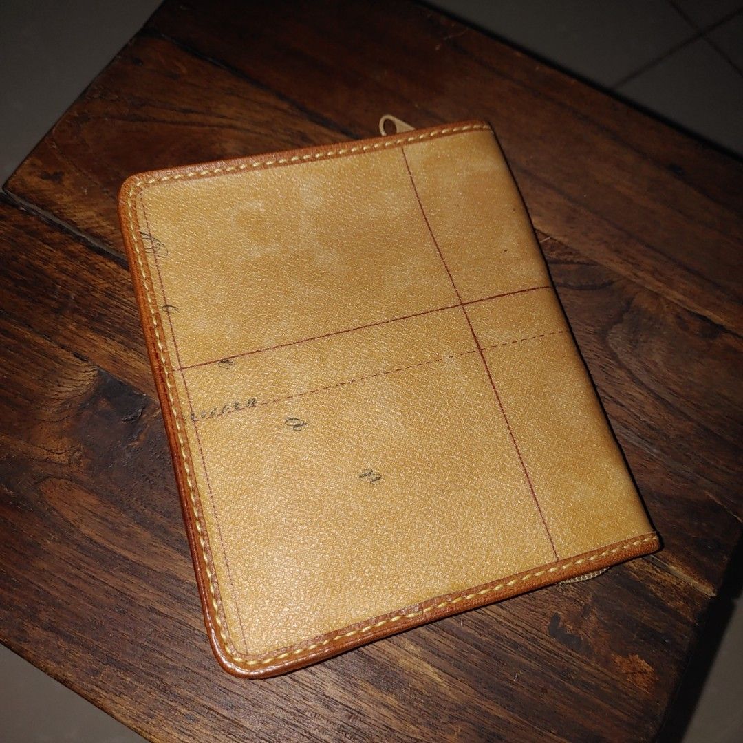 Alviero Martini Geo Map Wallet (Category: Luxury Bags & Wallets) located in Davao. Submitted by zenflower_2e78e8 (Listing ID 1394569110, Image 2). Description: - Authentic Alviero Martini wallet - Unique geo map design - Multiple card slots - Secure zippered closure - Compact size - Light brown interior lining - Brand name visible inside.