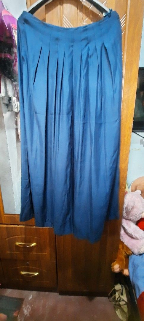 Blue Pleated Pants Size 27 (Category: Skirts) located in Caloocan City. Submitted by maxineshop (Listing ID 1394469754, Image 2). Description: - Blue pleated wide leg pant - Size 27 - Classic design - Smooth fabric - Versatile for different occasions.