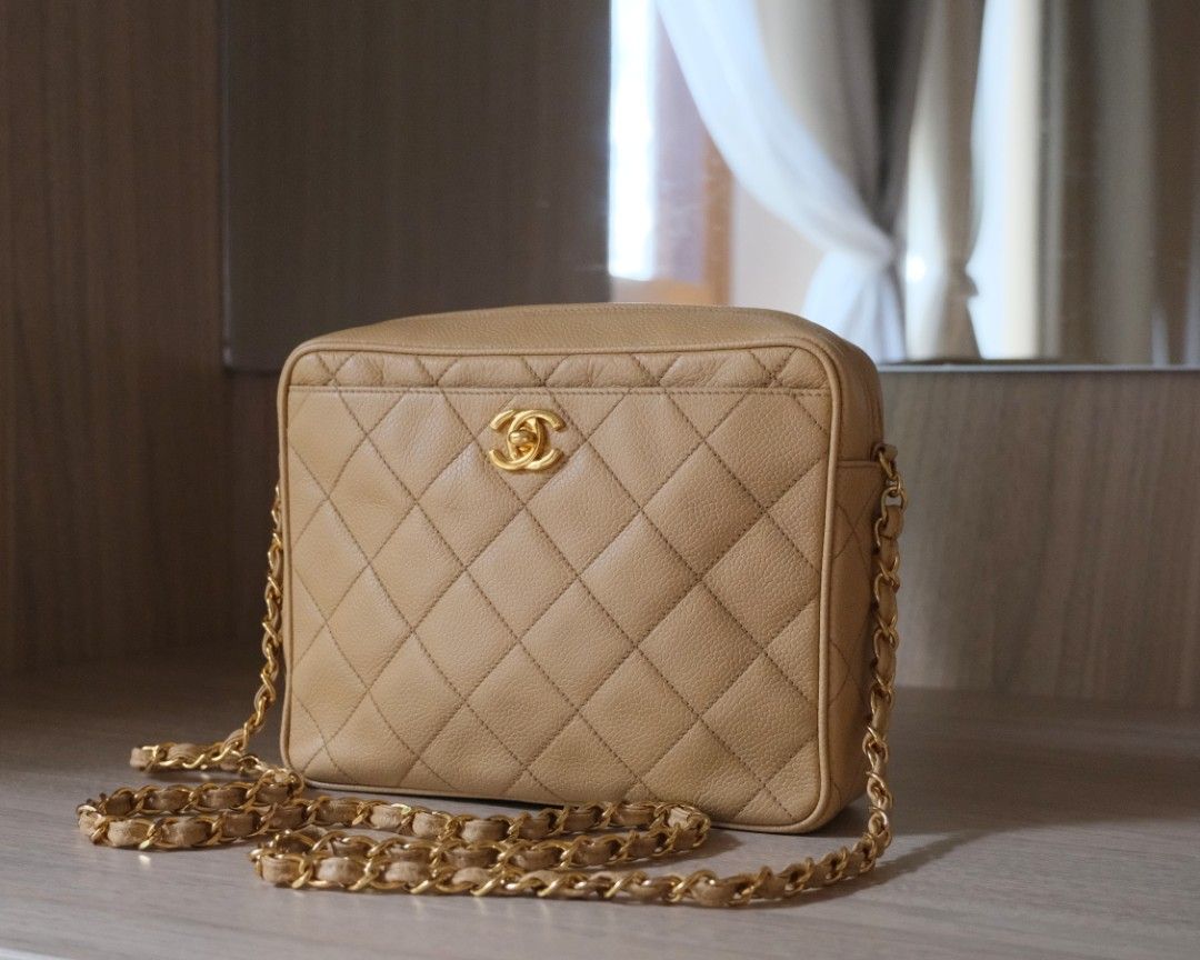 Chanel Quilted Crossbody Camera Bag (Category: Luxury Bags & Wallets) located in Candon. Submitted by curatedlux.ph (Listing ID 1394597601, Image 1). Description: - Authentic Chanel Crossbody Bag - Beige color - Quilted design - Gold chain strap - Zip closure - Leather Chanel logo tag - Rectangular shape - Includes serial number sticker.