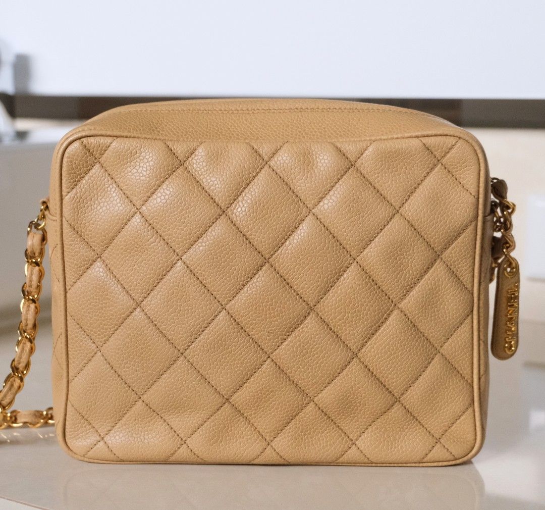 Chanel Quilted Crossbody Camera Bag (Category: Luxury Bags & Wallets) located in Candon. Submitted by curatedlux.ph (Listing ID 1394597601, Image 3). Description: - Authentic Chanel Crossbody Bag - Beige color - Quilted design - Gold chain strap - Zip closure - Leather Chanel logo tag - Rectangular shape - Includes serial number sticker.