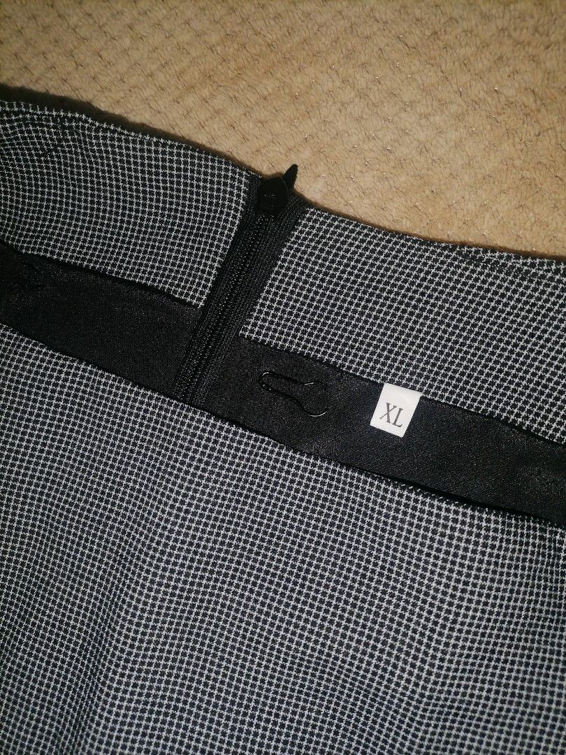 Checkered Plus Size Skirt (Category: Skirts) located in Muntinlupa City. Submitted by dmgdbee (Listing ID 1394484087, Image 3). Description: rfs: wrong size - XL size, 30-31 - Checkered pattern - Wrap-style design - Button details - Back zipper closure - Classic design - Suitable for various occasions - No inner short.