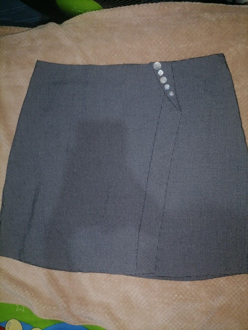 Checkered Plus Size Skirt (Category: Skirts) located in Muntinlupa City. Submitted by dmgdbee (Listing ID 1394484087, Image 1). Description: rfs: wrong size - XL size, 30-31 - Checkered pattern - Wrap-style design - Button details - Back zipper closure - Classic design - Suitable for various occasions - No inner short.