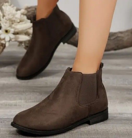 Dark Brown Chelsea Boots Size 39.5 (Category: Boots) located in Baguio. Submitted by kikay_moto (Listing ID 1394468147, Image 2). Description: - Dark brown Suede Chelsea boots - Size: 39.5 - Features: Pull tab, elastic side panels - Sole: Flat - Texture: Suede-like - Perfect for everyday wear - Offers both comfort and style.