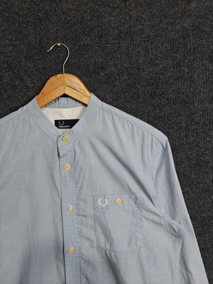 Fred Perry Band Collar Shirt (Category: Activewear) located in Alaminos. Submitted by epargne (Listing ID 1394416052, Image 2). Description: Fred Perry Band Collar Shirt Size: Medium Length: 28 Armpit to Armpit/Width: 20 Condition: Vgood ! Color Rate: 9/10 Issue: Basag ang butones, may extra sa washtag palitan niyo nalang. WASHED AND READY TO WEAR 👕.