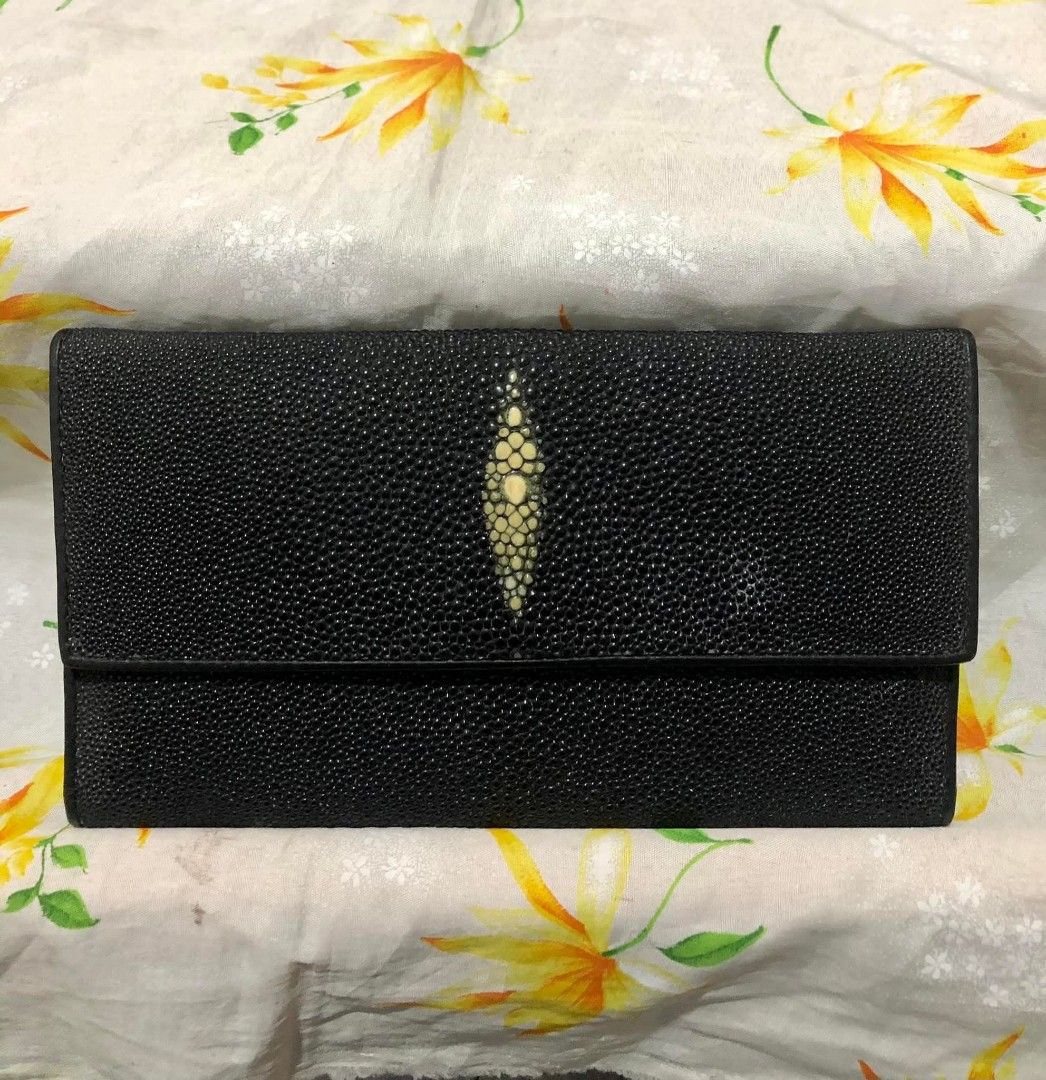 Genuine Stingray Leather Wallet (Category: Wallets & Card holders) located in Baguio. Submitted by blossombeauty.chicfinds23 (Listing ID 1394598408, Image 2). Description: - Genuine stingray leather wallet - Black color - Distinctive central eye pattern - Multiple card slots - Bill compartments - Snap closure - Gold-colored logo - Well-maintained condition.