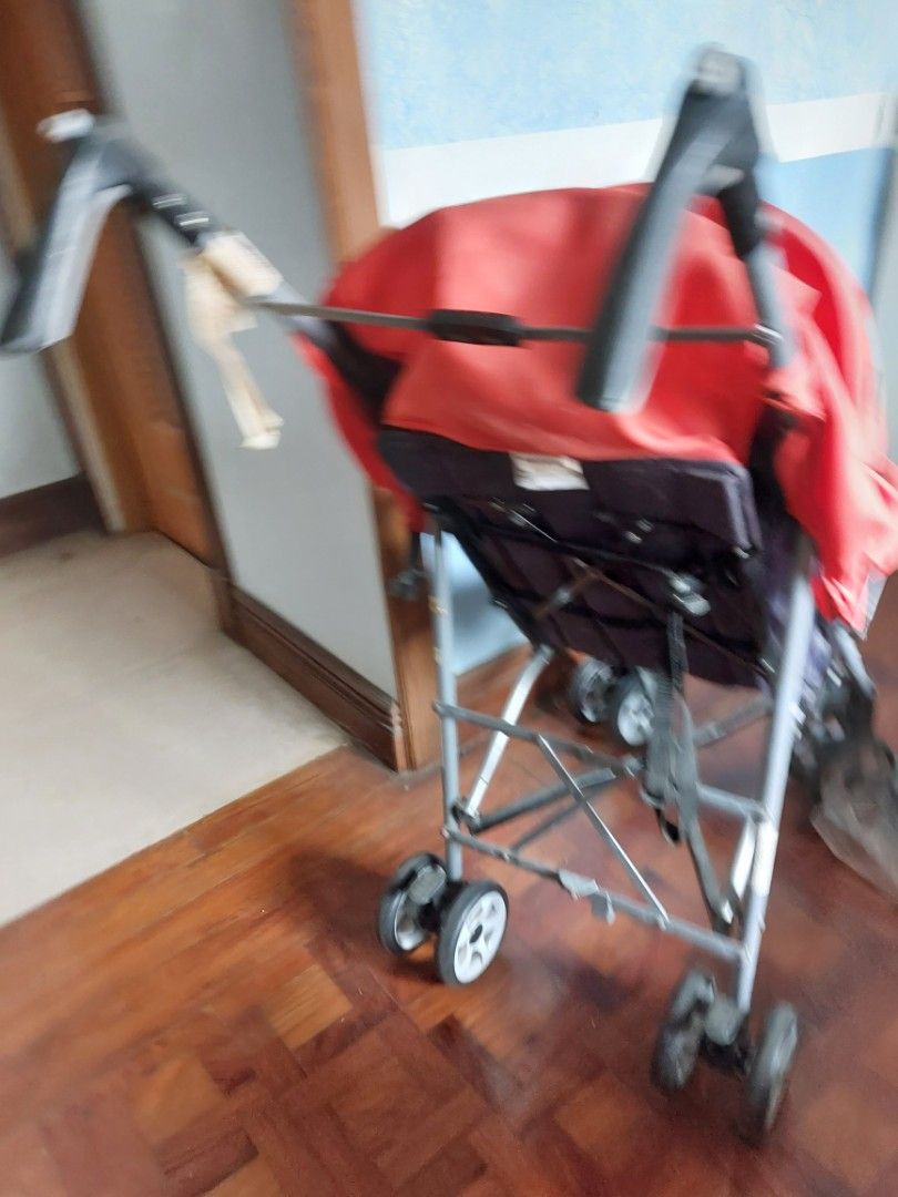 Happy Dino Baby Stroller with Red Canopy (Category: Strollers) located in Rizal. Submitted by Babyfume (Listing ID 1394431806, Image 3). Description: - Red canopy - Dark grey seat - Foldable for easy storage and transport - Multiple wheels for stability - Beige handle.