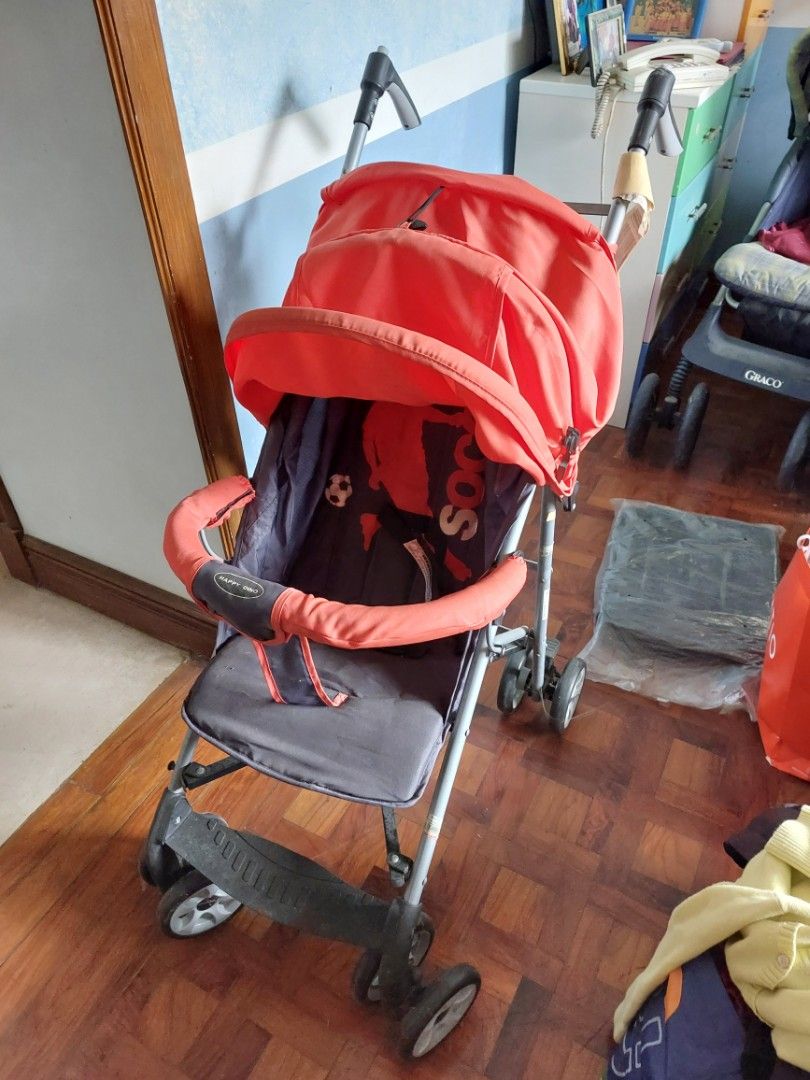 Happy Dino Baby Stroller with Red Canopy (Category: Strollers) located in Rizal. Submitted by Babyfume (Listing ID 1394431806, Image 2). Description: - Red canopy - Dark grey seat - Foldable for easy storage and transport - Multiple wheels for stability - Beige handle.