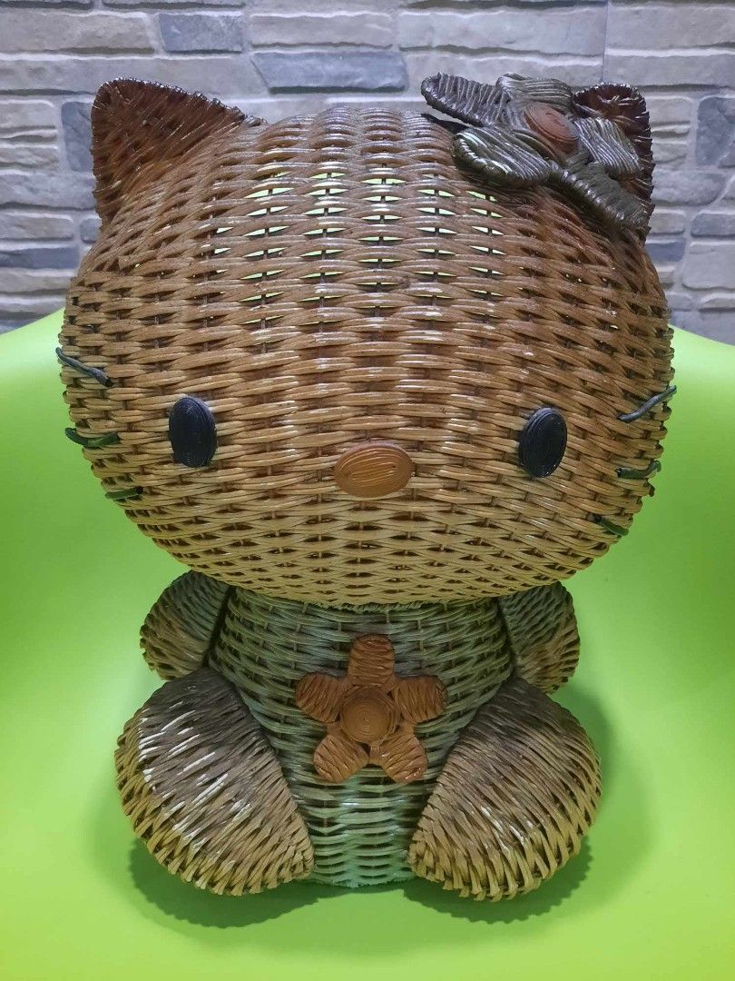 Hello Kitty Woven Basket (Category: Storage Boxes & Baskets) located in Quezon City. Submitted by threetwotwo2ndaccount (Listing ID 1394452449, Image 1). Description: - Vintage Kitty basket - Made of woven material - Features Kitty's face, bow, and flower - From Sanrio, Tokyo, Japan (1976-1999) - Approximately 15 inches tall.
