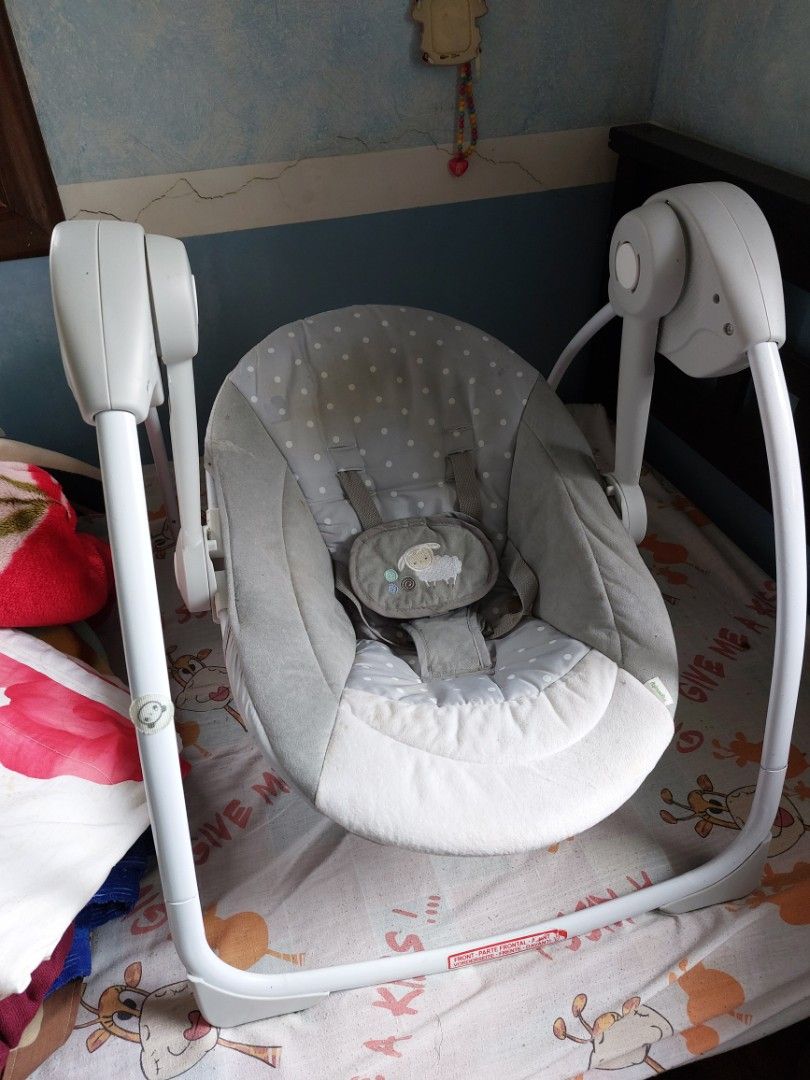 Ingenuity Soothe 'n Delight Portable Swing (Category: Cots & Cribs) located in Rizal. Submitted by Babyfume (Listing ID 1394437622, Image 2). Description: - Ingenuity Soothe 'n Delight Portable Swing - For babies 0-9 months - Multiple swing speeds - Soothing music and timer - Removable toy bar - Compact and easy to store/travel - Requires 4 C batteries (not included) -only used for 6 months -will clean and disinfect before shipping.
