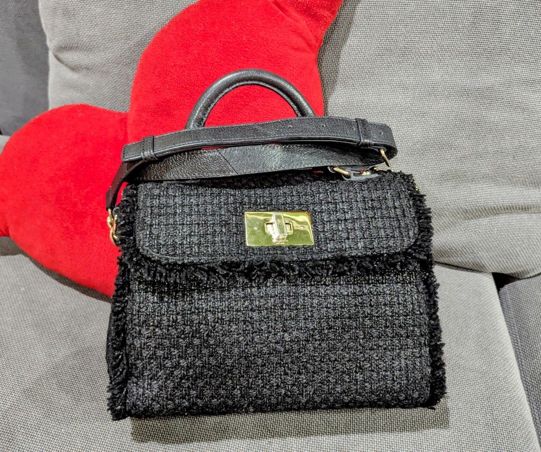 Kate Spade Black Tweed Handbag (Category: Luxury Bags & Wallets) located in Las Pinas. Submitted by rozramer (Listing ID 1394484599, Image 1). Description: - Kate Spade black tweed handbag - Top handle and detachable shoulder strap - Gold-tone clasp closure - Gold hardware - Four gold feet - As seen on Beyonce in NYC **Negotiable *PLEASE NOTE: This has a slight issue that doesn't affect the closure. It has a lift-turn lock mechanism. Item is from