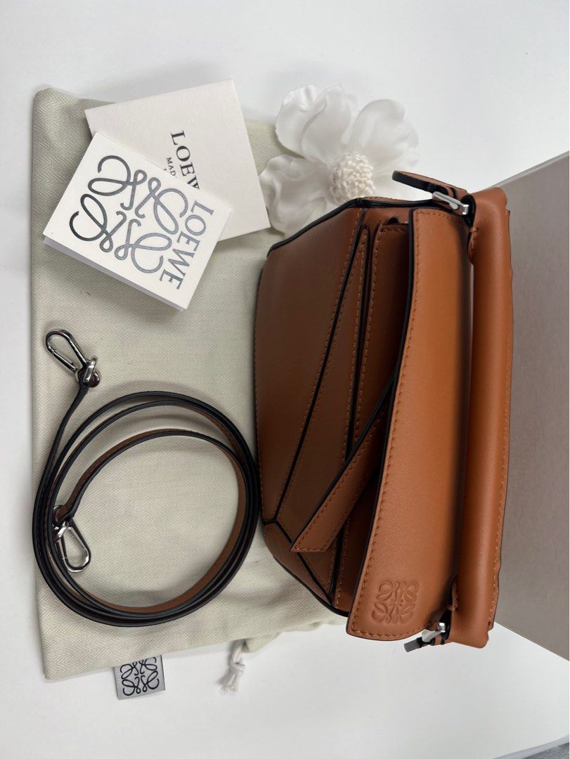 ⚜️Loewe Mini puzzle bag (Category: Luxury Bags & Wallets) located in Makati City. Submitted by 90sangel (Listing ID 1394593407, Image 3). Description: •Item: Loewe mini puzzle bag in brown/tan⚜️🍁🍂👜 •Size: Mini, so cute! •Condition: Hard to find, gently used and good as new! *This includes box, dustbag cards & paperbag. .