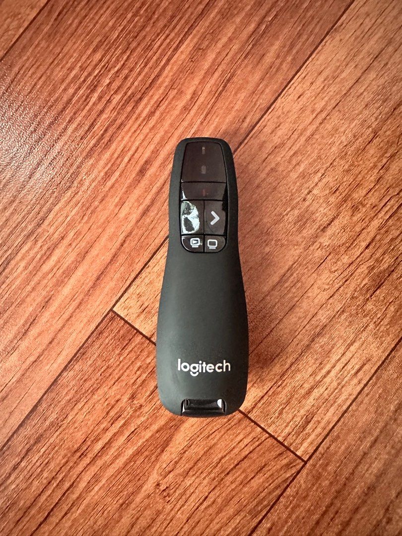 Logitech Presentation Remote (Category: Office & Business Technology) located in Singapore. Submitted by oslorie (Listing ID 1394539377, Image 1). Description: - Logitech presentation remote - Forward/back buttons - Built-in laser pointer - Ideal for presentations - In good working condition.
