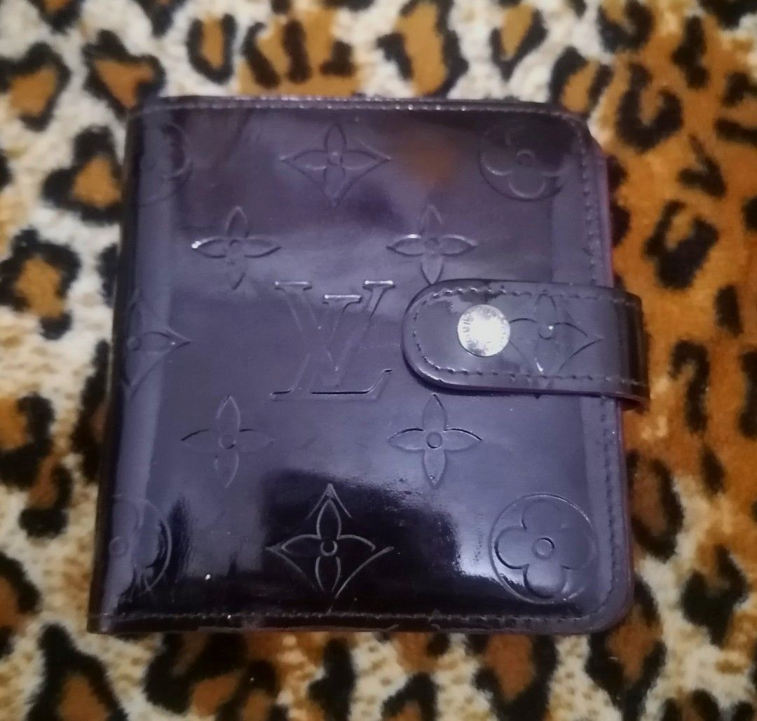 Louis Vuitton Vernis Wallet (Category: Luxury Bags & Wallets) located in Cebu City. Submitted by roadthrift (Listing ID 1394425319, Image 1). Description: - Authentic Louis Vuitton Vernis wallet - Glossy, embossed exterior with LV monogram - Interior: card slots, bill compartment, zippered coin pocket - Made in France - Snap closure.
