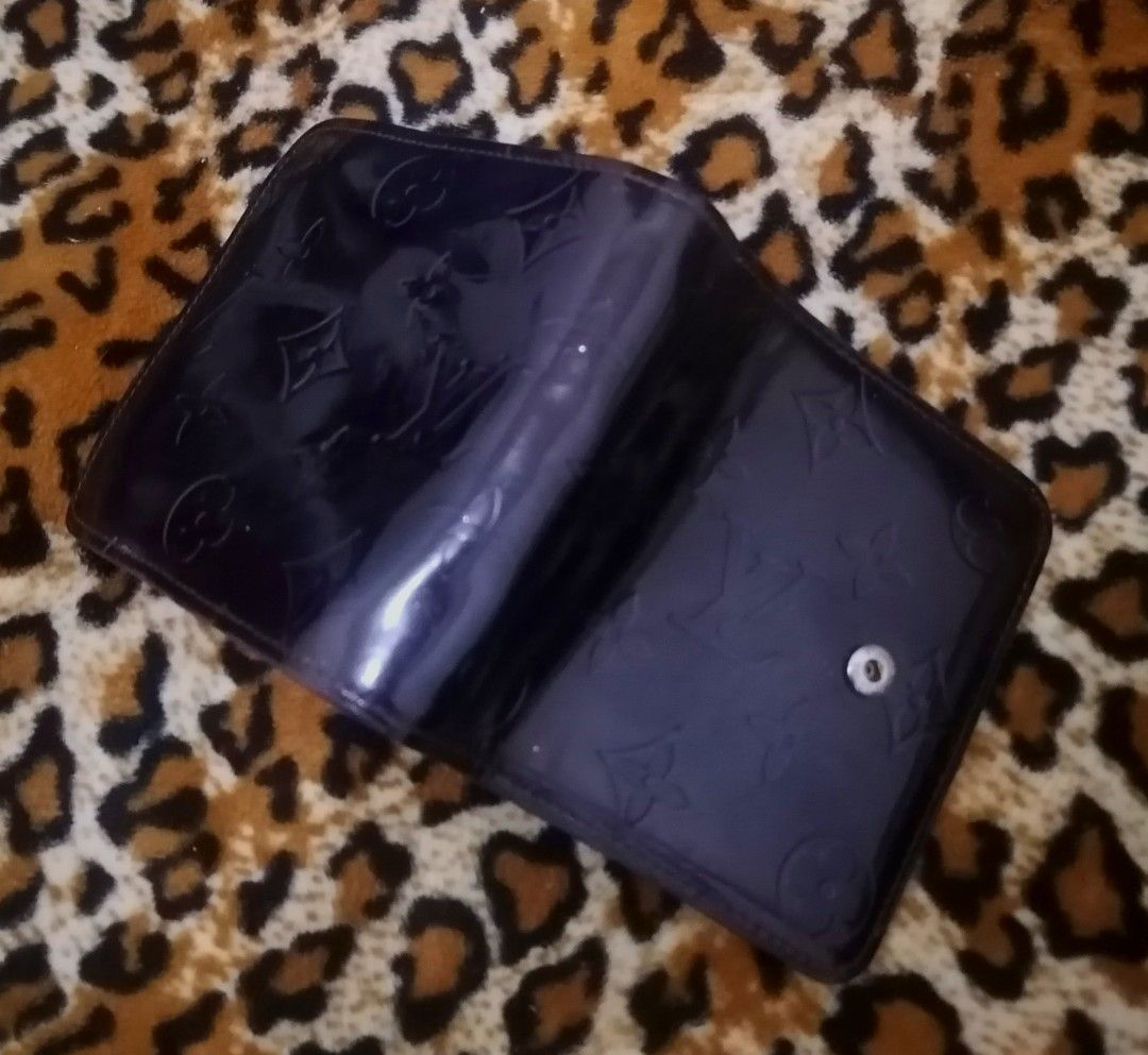 Louis Vuitton Vernis Wallet (Category: Luxury Bags & Wallets) located in Cebu City. Submitted by roadthrift (Listing ID 1394425319, Image 3). Description: - Authentic Louis Vuitton Vernis wallet - Glossy, embossed exterior with LV monogram - Interior: card slots, bill compartment, zippered coin pocket - Made in France - Snap closure.