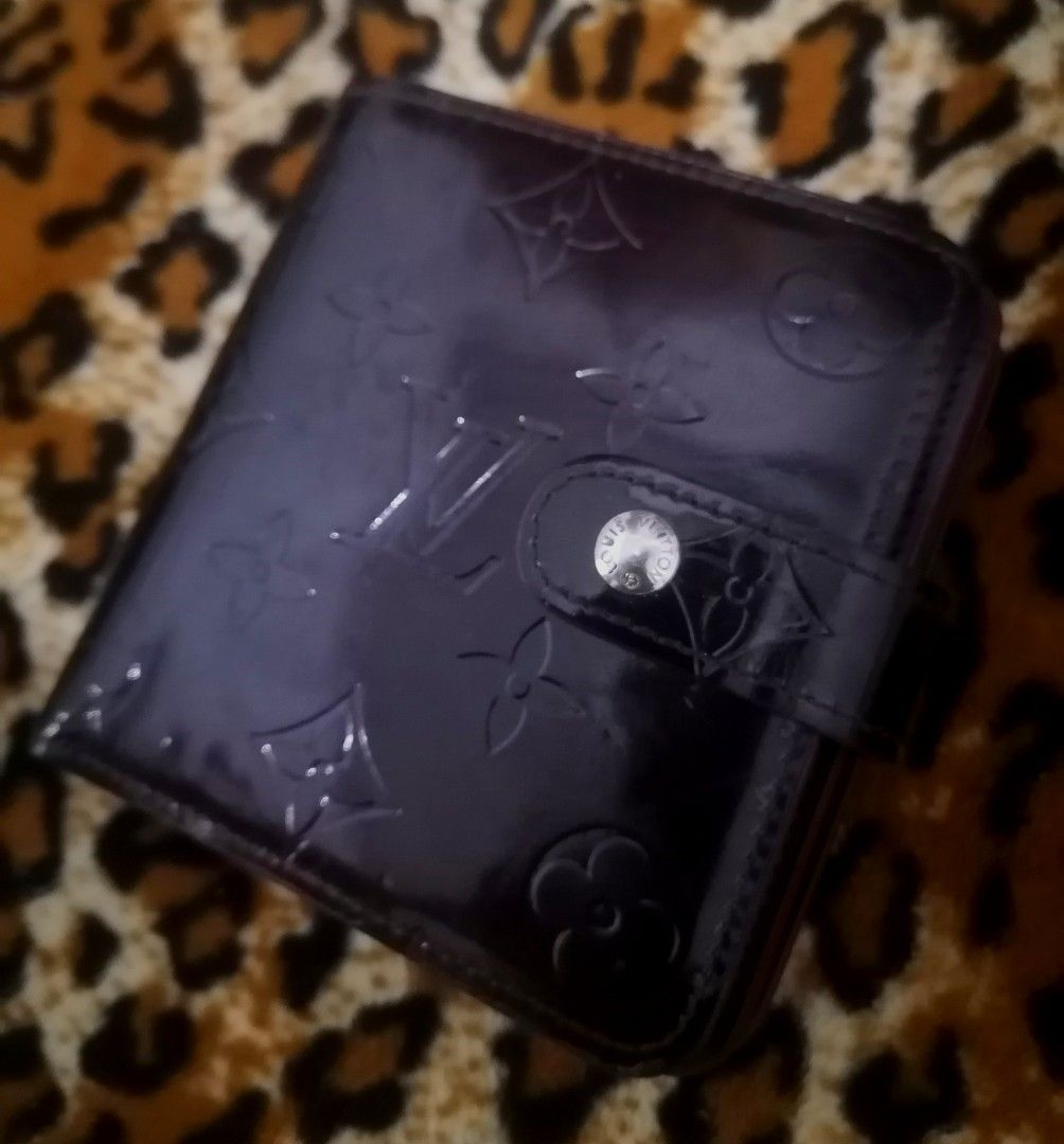 Louis Vuitton Vernis Wallet (Category: Luxury Bags & Wallets) located in Cebu City. Submitted by roadthrift (Listing ID 1394425319, Image 2). Description: - Authentic Louis Vuitton Vernis wallet - Glossy, embossed exterior with LV monogram - Interior: card slots, bill compartment, zippered coin pocket - Made in France - Snap closure.