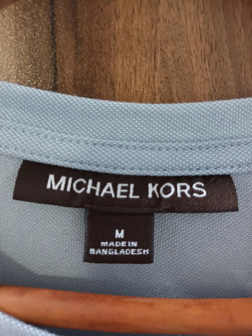 Michael Kors Light Blue T-shirt - Size M (Category: Tshirts & Polo Shirts ) located in Paranaque City. Submitted by maria_2010 (Listing ID 1394434701, Image 3). Description: Washed, unused - Light blue color - Made in Bangladesh - Short sleeves - Crew neck - Features the Michael Kors logo.