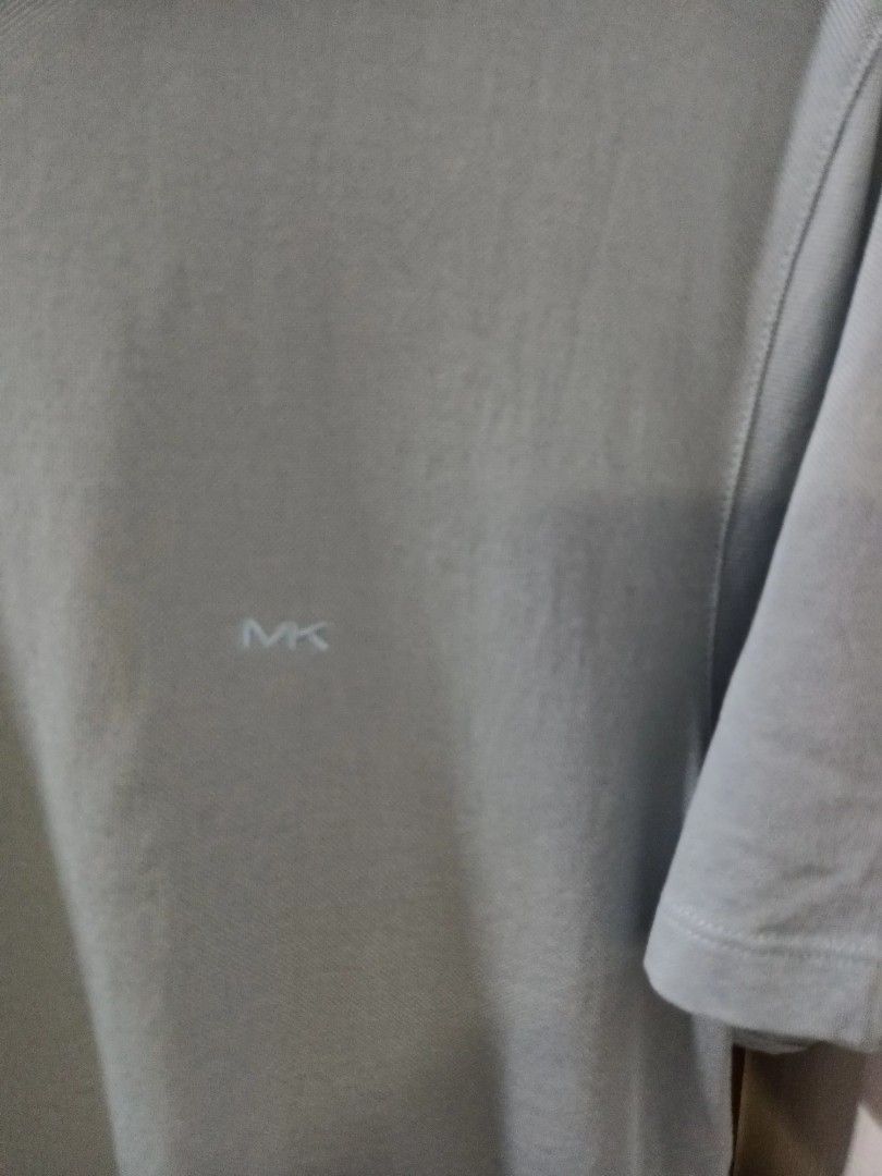 Michael Kors Light Blue T-shirt - Size M (Category: Tshirts & Polo Shirts ) located in Paranaque City. Submitted by maria_2010 (Listing ID 1394434701, Image 2). Description: Washed, unused - Light blue color - Made in Bangladesh - Short sleeves - Crew neck - Features the Michael Kors logo.