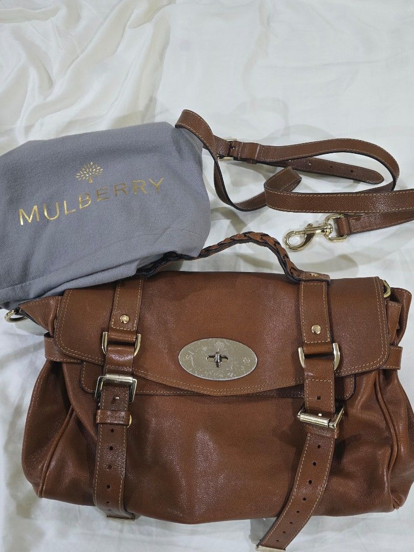Mulberry Alexa Satchel Bag (Category: Luxury Bags & Wallets) located in Cebu City. Submitted by alma.ido (Listing ID 1394563503, Image 1). Description: - Authentic Mulberry handbag - Soft brown leather, Distressed Calf - Size: Regular Classic / Medium - Flap closure with buckle details - Detachable shoulder long strap - Includes dust bag - Interior: zipped pocket and Mulberry logo tag: Suede and Canvass Leather Mix - Serial number: 2132347 - Hard