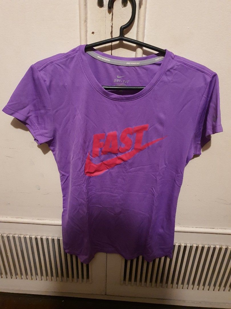 Nike Dri-FIT Running Shirt (Category: Activewear) located in Caloocan City. Submitted by swiftwolf-dcd8 (Listing ID 1394551555, Image 1). Description: - Nike Dri-FIT running shirt - Color: Purple - Size: S - Features Nike logo (front and back) - Short sleeves - Round neck - Made in Malaysia -Actual Dimensions: 16"x23" shipping fee will be shouldered by the buyer.