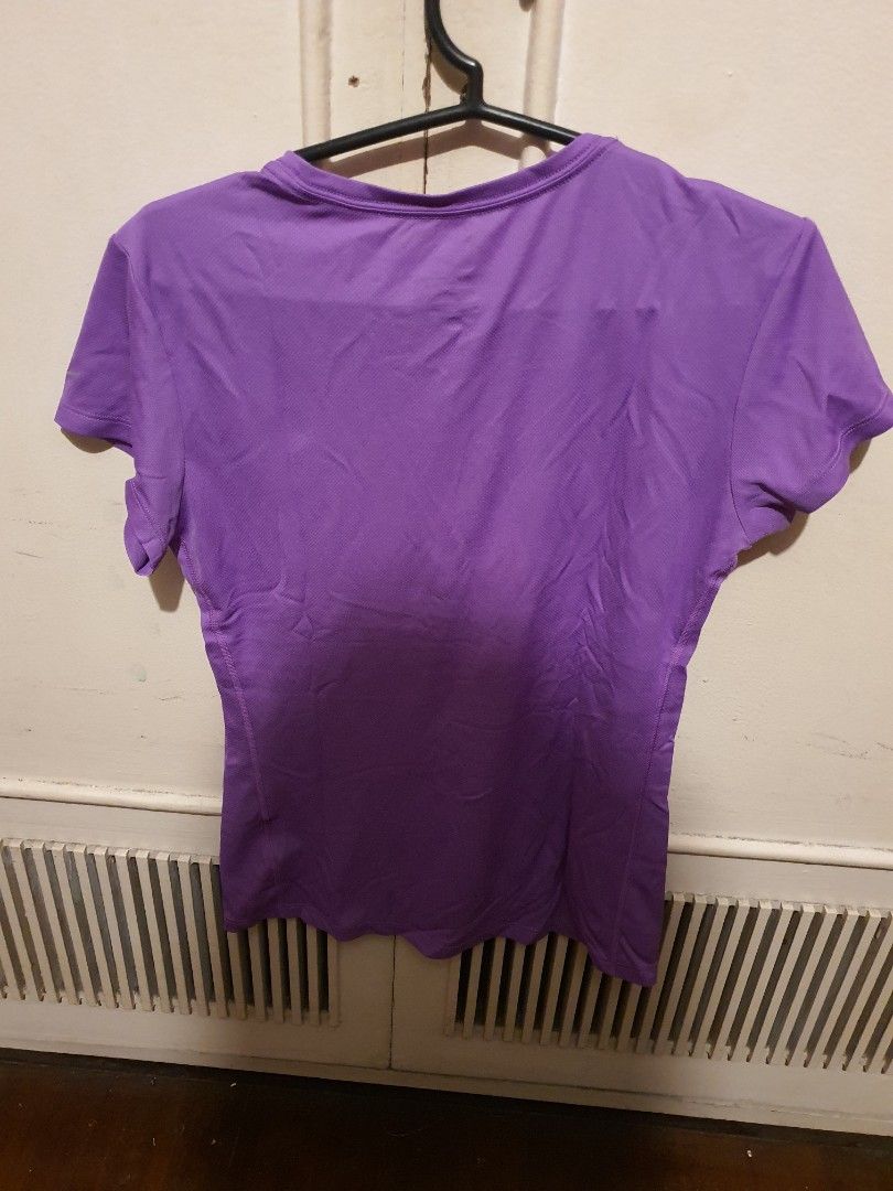 Nike Dri-FIT Running Shirt (Category: Activewear) located in Caloocan City. Submitted by swiftwolf-dcd8 (Listing ID 1394551555, Image 2). Description: - Nike Dri-FIT running shirt - Color: Purple - Size: S - Features Nike logo (front and back) - Short sleeves - Round neck - Made in Malaysia -Actual Dimensions: 16"x23" shipping fee will be shouldered by the buyer.