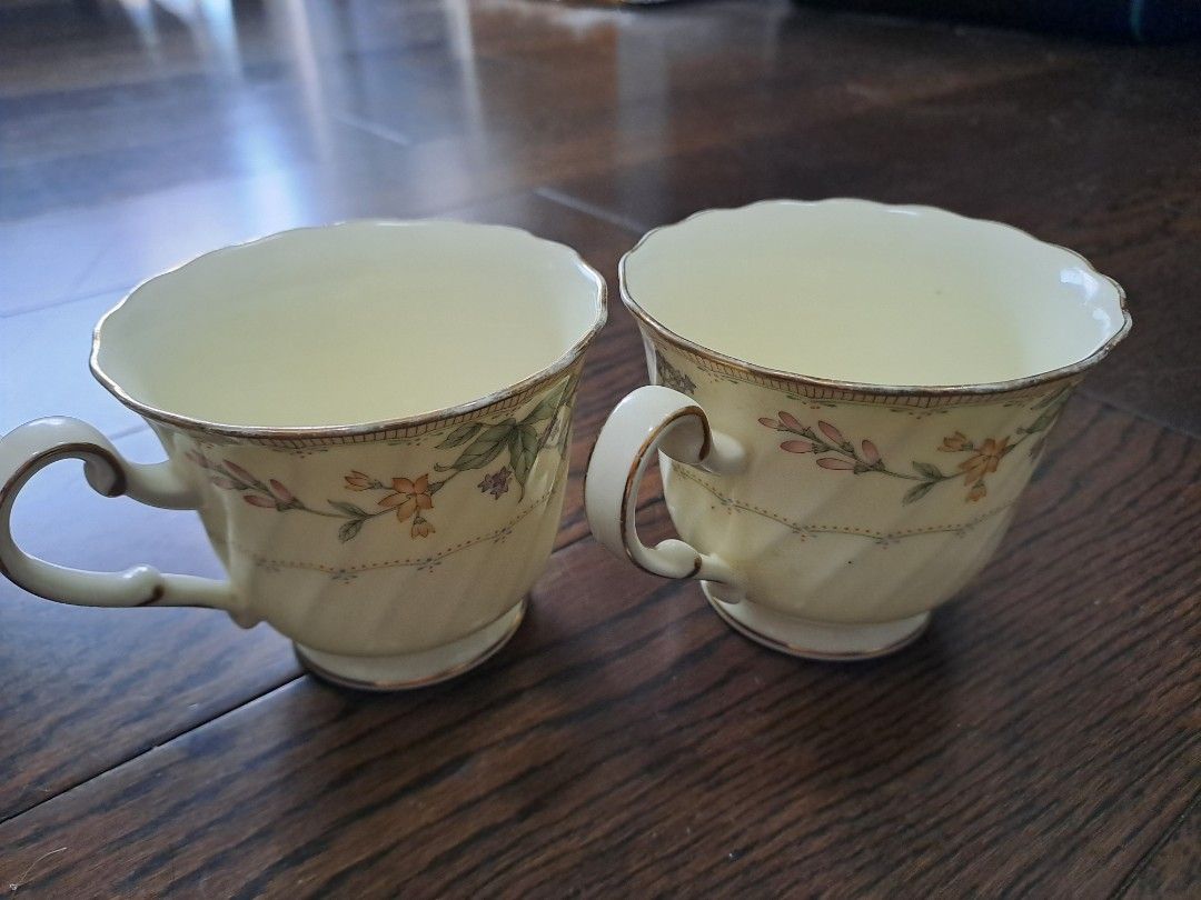 Noritake Teacups Set of 2 (Category: Coffee & Tea Tableware) located in Manila. Submitted by joanbalde39643 (Listing ID 1394460505, Image 2). Description: - Set of two Noritake teacups - Features a beautiful floral design - Elegant gold trim - Classic, curved handle - Authentic Noritake brand - Ideal for tea or coffee.